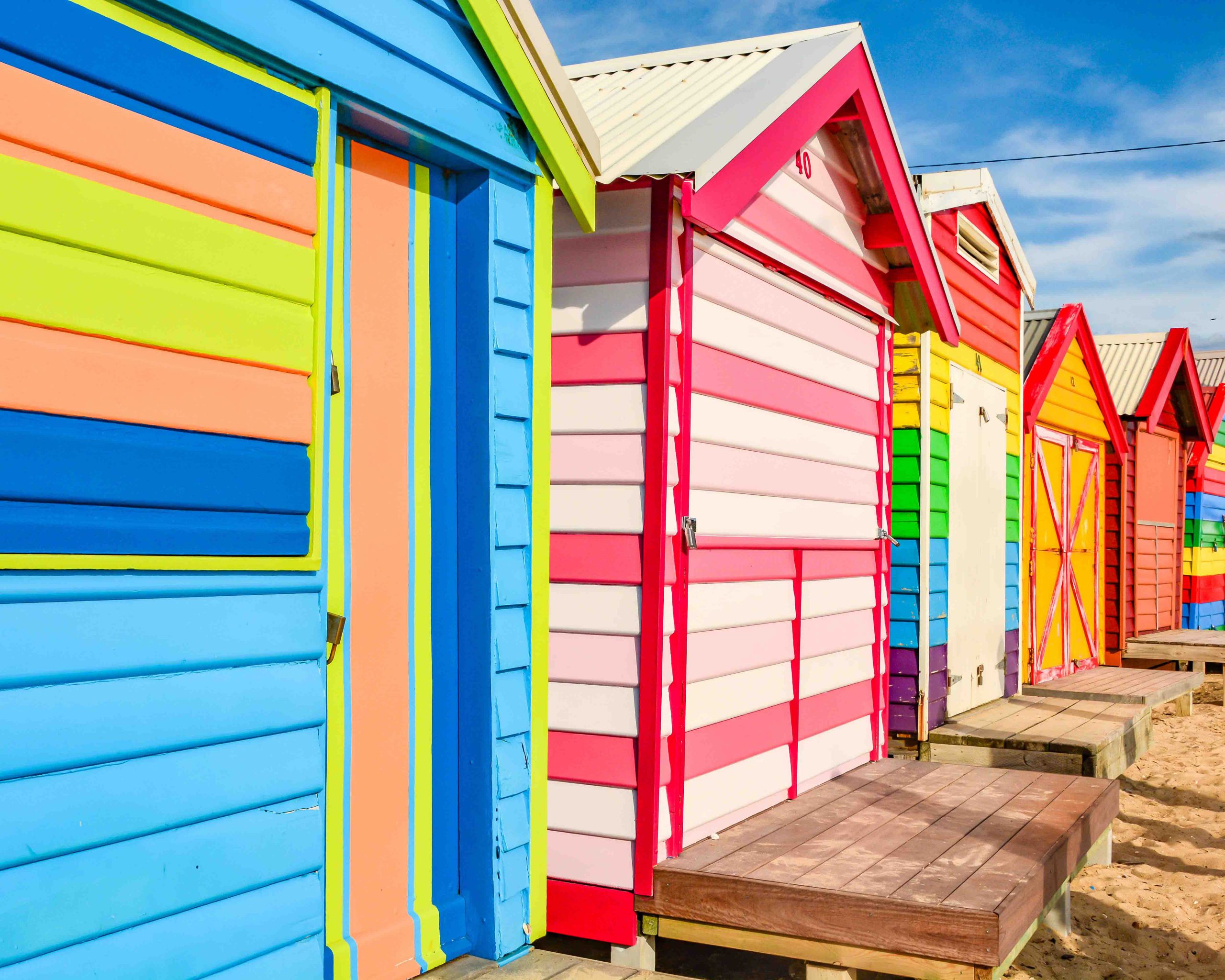 Colorful,Beach Houses (bathing Boxes) Under Summer Sky At Brighton